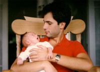 Me, the newborn, with my dad.
