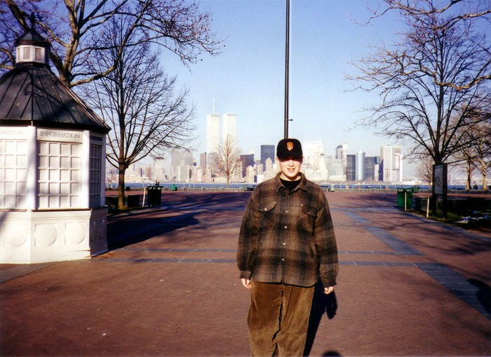 Me on Liberty Island in 1994 with the World Trade Center towers in the background.