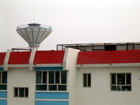The view from our livingroom window...the Chinese seem to have towers like this sprinkled all over the place in western towns and cities. I suspect it's a man-made military highground. I've never seen anyone up there, however.