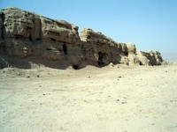 A big wall remains where there must of once been an impressive building.