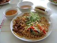 Mmmm! Liang Ba Mian (cold spicy noodles with cilantro, cucumber, bean sprouts, and a bit of mutton) and a Rou Jia Mo (a spicy, oily mutton sandwich)...also known affectionately as a Roger Moore. My lunch every Saturday.