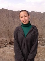 Liu Xin, only days after cutting off all of her hair. Now it's longer.