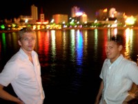 William (left) and Small David (right) pose for an eerie night-shot along the banks of the Kong Que River in downtown Korla.