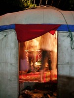Looking in at the yurt party from outside the yurt.