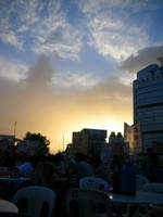 Watching the sunset while eating spicy barbecued vegetables at the night market.