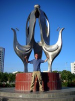 Daniel Peacock, my new roommate, has arrived in Korla from England. We took this photo in Peacock Park in front of the peacock statue. Get it?
