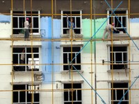 Construction workers in China are pretty nuts. The scaffolding is almost nonexistent, and they shimmy up and down the poles with only a rope tied around their waists. They've almost finished the new apartment building behind my new place.
