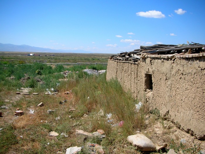This house's backyard would be in Kazakhstan if it wasn't for the fence.