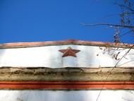 Out exploring in the farm beyond Korla, I came upon this old building bearing the star of the Communist Party. Upon further inspection, every room in the building is now being used as a toilet.
