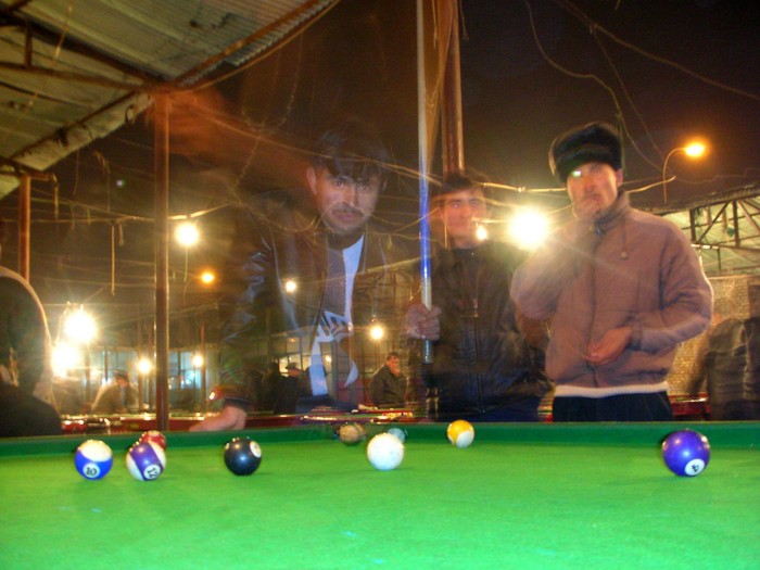 Hanging out with some Uyghur buddies at Korla's only outdoor pool hall still open in sub-freezing temperatures.