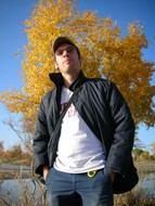 My Qu�b�cois roomate, Dominic Gagnon, power poses in front of a golden poplar.