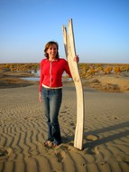 Camilla poses atop a sand dune with her proposed sand-sled. It didn't work.