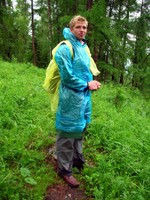 We started our supposedly one-and-a-half hour hike to the Kanas Lake viewing pavilion in the rain. Four hours or so later, we made it to the top. Along the way, I met this strange man dressed in plastic bags.