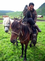 No sooner had we made our way back down the mountain than we were approached by this Kazakh guy and his friends. They wanted to take us on a two-day horse trip to Hemu. We said, "Sure. What the heck."