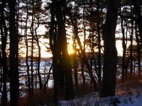 The sun sets over New England, as viewed from Castle Hill.