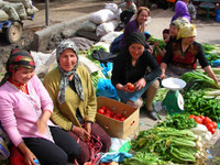 Uyghur women selling vegetables at Kuqa's Friday bazaar.