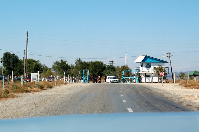 Leaving Kazakhstan behind, with the trunk of our Lada taxi bouncing into view.