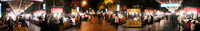 A 180-degree panorama shot of a night market in Urumqi.