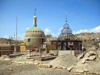 Poor Uyghurs get mounds of dirts with a little fence and some tufts of animal hair for a grave. The wealthier ones build more impressive structures.