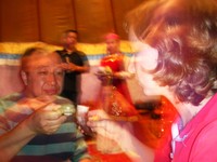 Camilla gets ready to knock-back a horn full of baijiu (awful, awful, awful "white spirits") with Big David's flatmate.