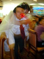I was invited with Camilla to a Hua Shan teacher's wedding party. Here, the groom is forced to carry the bride on his back around the room while blowing a horn.