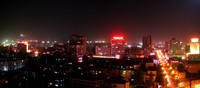 A nightime panorama of Korla's skyline.