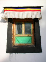 A typical feature of Tibetan architecture is the trapezoidal window frame.