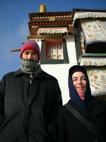 Chris and Rachel pose in the cold in front of Labrang's main temple.