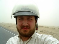 Self-portrait, with helmet, in the northern Taklamakan.