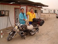 The only gas station for 250+ km in either direction is at Tazhong (which literally means "middle of the Taklamakan"). I was their first foreign customer. Fill 'er up!