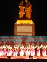 Shake your booty! A big Uyghur song-and-dance show under the watchful eye of Mao.