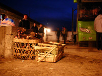 Our bus parked behind a small restaurant in Zoige. Baskets full of delicious and savory yak feet in the foreground. (No, I didn't try 'em.)