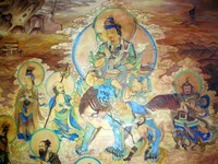 Compare this wall painting to the Tibetan-style one in the Labrang Monastery gallery. The style in Sichuan is definetely more "Chinese".