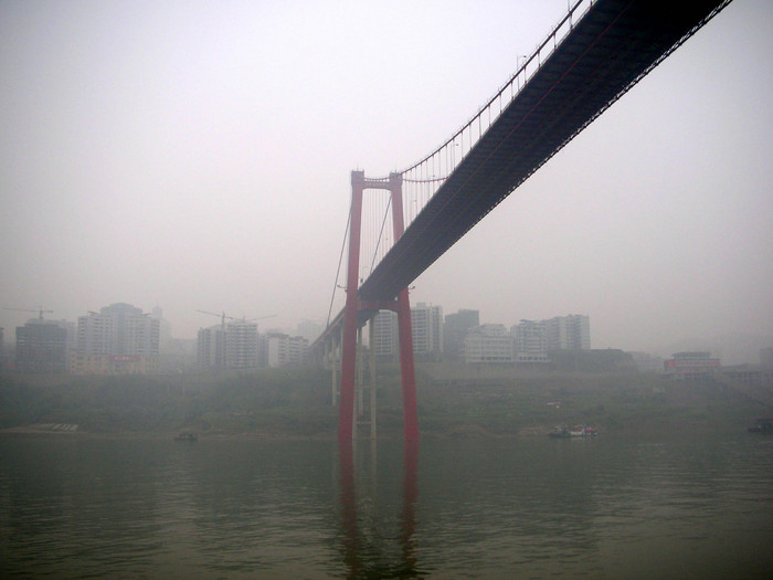 Passing under one of the fancy, modern bridges that the Chinese have constructed over the Yangzi in the past few years.