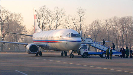 Boarding an early morning flight to Korla at Beijing's Nanyuan Airport.