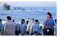 The Golden Venture, filled with illegal Chinese immigrants, ran ashore off of Queens, New York on June 6, 1993.