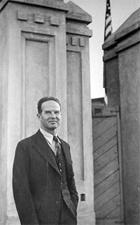 US Consul Edmund Clubb standing outside building.