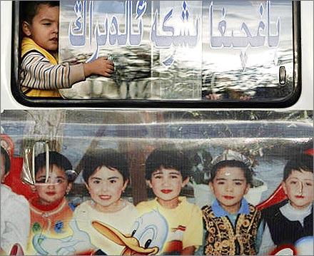 Uyghur child on a bus.