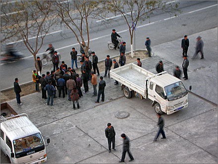 Uyghurs arguing on the street in front of my apartment. 2005.